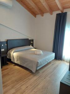 Postel nebo postele na pokoji v ubytování IL VITIGNO