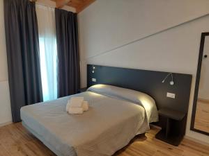 Postel nebo postele na pokoji v ubytování IL VITIGNO