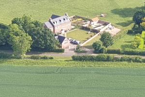 an aerial view of a large house in a field at Boutique double room with country village views in Wilby