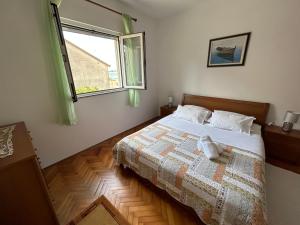 Ένα ή περισσότερα κρεβάτια σε δωμάτιο στο Apartman Filip