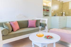 a living room with a couch and a table at LA CASA DI MARCONI in Symi +44 photos
