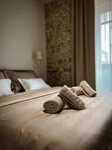 a hotel room with two towels on a bed at Imperial apartments in Split