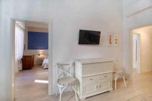 A television and/or entertainment centre at San marco elegant apartment