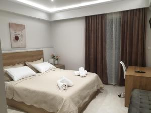 Ένα ή περισσότερα κρεβάτια σε δωμάτιο στο Διαμέρισμα στο κέντρο