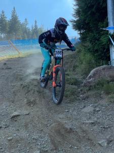 a person riding a bike on a dirt road at SW Apartamenty Czarna Góra in Sienna