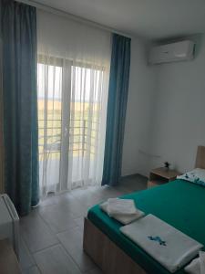 Кровать или кровати в номере Vila La Fernando