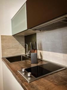 a kitchen with a sink and a counter top at Borna and Franko Rooms Split city centre in Split