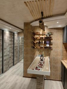 a bathroom with a bathtub in the middle of a room at Premium Urban Life in Zaječar