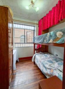 a bedroom with a bunk bed and a window at APARTAMENTO COMPLETO LIMA - 2 cuadras del Palacio Gobierno in Lima