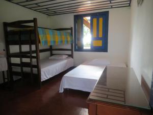 מיטה או מיטות קומותיים בחדר ב-Finca El Topacio Circasia-Quindio