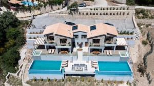 an aerial view of a house with a swimming pool at 180 Villas in Nydri