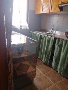 a kitchen with a sink and a counter top at La casa di Mo' in Torre Dei Corsari