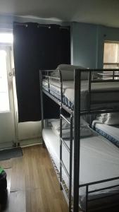 a group of bunk beds in a room at Queen Elizabeth Hostel in London