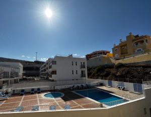 The swimming pool at or close to Relax and enjoy with a view of El Teide and sea