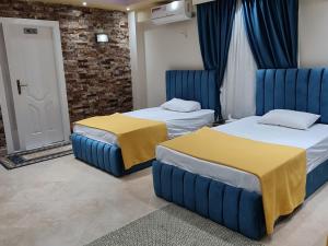 Postel nebo postele na pokoji v ubytování Luxury Suites Villa 53 - غرف فندقية