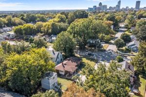 an aerial view of a residential neighborhood with a city skyline at Hargett Street Villa in Raleigh