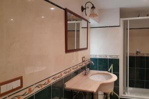 a bathroom with a sink and a mirror at La casa Maestri a Cetona in Cetona +24 photos