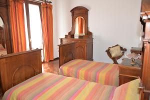 A bed or beds in a room at Villa Magnolia