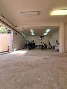 an empty garage with two motorcycles parked in it at Apartments Medulin - Orijeta in Medulin