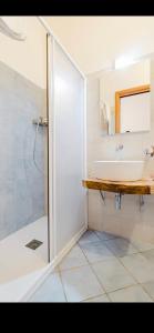 a bathroom with a sink and a shower at Residenza Matilde in Fiumefreddo Bruzio
