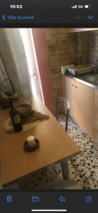 a table in a kitchen with a bowl on it at appartment view sea artemida 2 in Artemida +7 photos