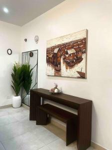 a room with a table and a painting on the wall at Luxurious1 bedroom apart in VI in Lagos