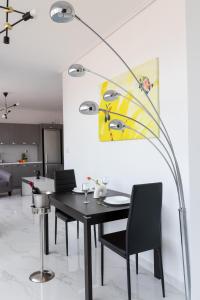 a dining room with a table and a painting on the wall at Z5 Sky Sparta Apartment in Sparta