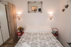 A bed or beds in a room at Mole Adriana Guest House