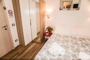 A bed or beds in a room at Mole Adriana Guest House