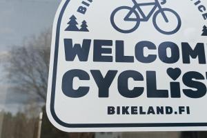 a sign for a welcome to bikeland at Salonsaaren Pappila in Terälahti