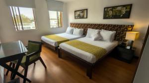 Postel nebo postele na pokoji v ubytování Hotel Charlotte Suite 26 + 37 fotografií