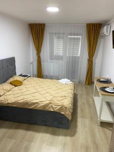 Postel nebo postele na pokoji v ubytování Garsoniera Luxury Kevin