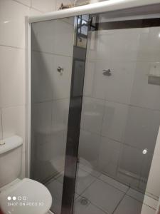 a shower stall in a bathroom with a toilet at Sítio Vista da Serra in Lavrinhas