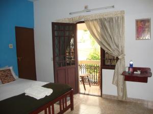 Postel nebo postele na pokoji v ubytování Lazar Residency Homestay