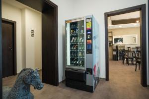 a toy horse sitting next to a vending machine at Riverside Hotel Plzeň in Plzeň