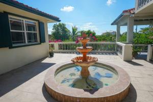 a fountain in the middle of a patio at Turquoise Haven Villa in Providenciales