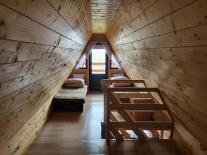 a small room with a staircase in a tiny house at O.W.S. Strzecha in Duszniki Zdrój