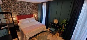 Posteľ alebo postele v izbe v ubytovaní Boutique Suites