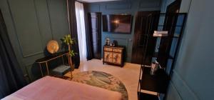 Posteľ alebo postele v izbe v ubytovaní Boutique Suites