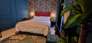 Posteľ alebo postele v izbe v ubytovaní Boutique Suites