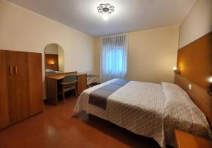 Postel nebo postele na pokoji v ubytování Altavilla Albergo meublé