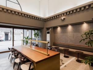 a dining room with a table and chairs at Hotel Arthur KITAHAMA BASE in Beppu