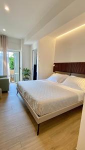 Säng eller sängar i ett rum på Casa Degli Dei Tropea -Luxury Rooms-