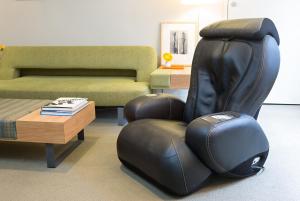 a black reclining chair in a living room with a table at Shoreham Hotel in New York