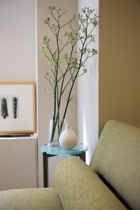 a vase sitting on a table next to a couch at Shoreham Hotel in New York