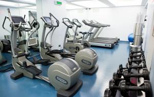 a gym with several treadmills and cardio machines at Shoreham Hotel in New York