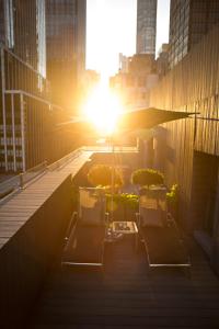 a view of the sun setting in a city at Shoreham Hotel in New York