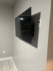 a flat screen tv hanging on a wall at Welcome to the AUC Modern Unit in Atlanta