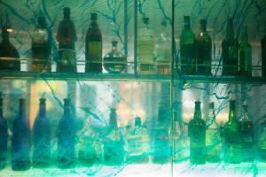 a display of bottles of wine on a shelf at Shoreham Hotel in New York