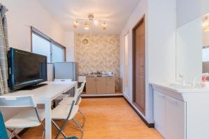 TV a/nebo společenská místnost v ubytování Tokyo SA Ryokan